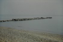 View of damaged long concrete pier
